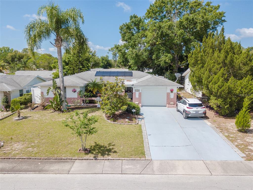 5213 Idlewild Street New Port Richey, FL 34653 - Photo 1 of 1 a view of a white house with a yard