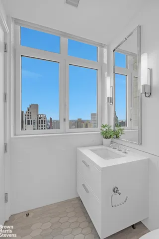 a bathroom with a sink a toilet and vanity