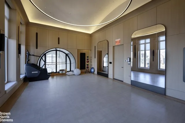 a view of living room with gym equipment