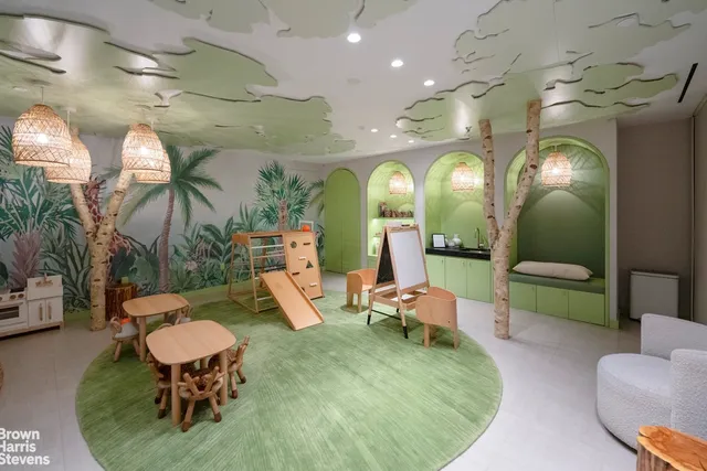 a living room with lots of furniture and a chandelier