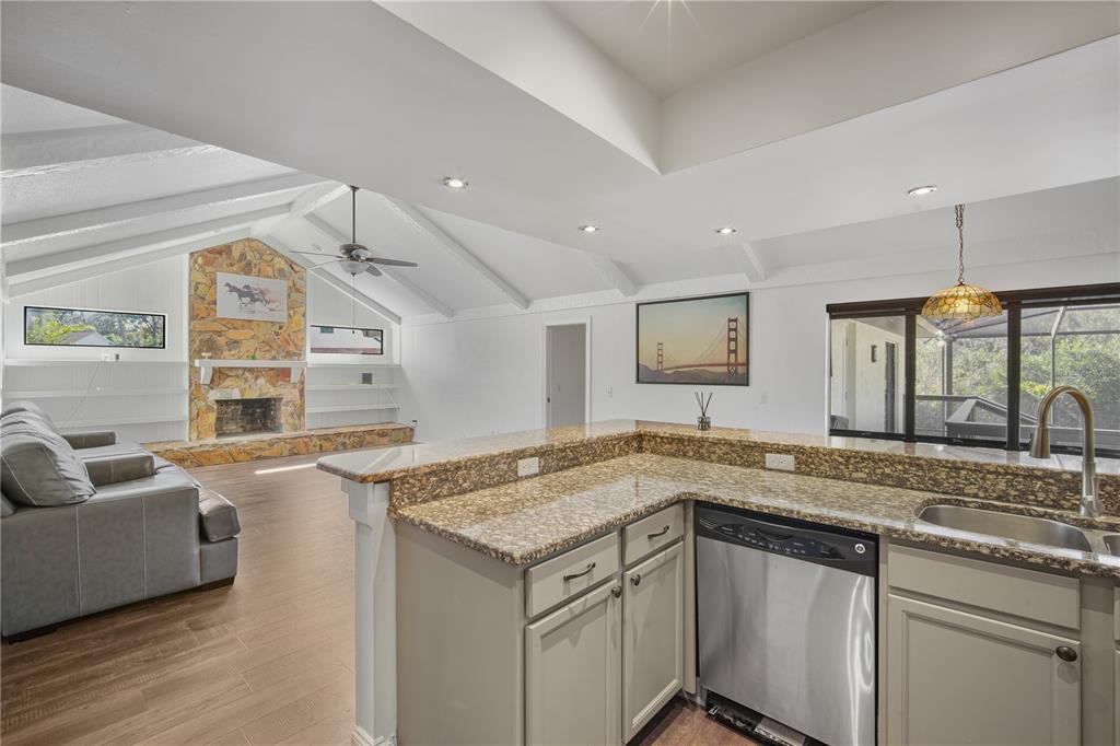 109 Holly Tree Lane Brandon, FL 33511 - Photo 11 of 31 a kitchen with a stove a sink and a refrigerator