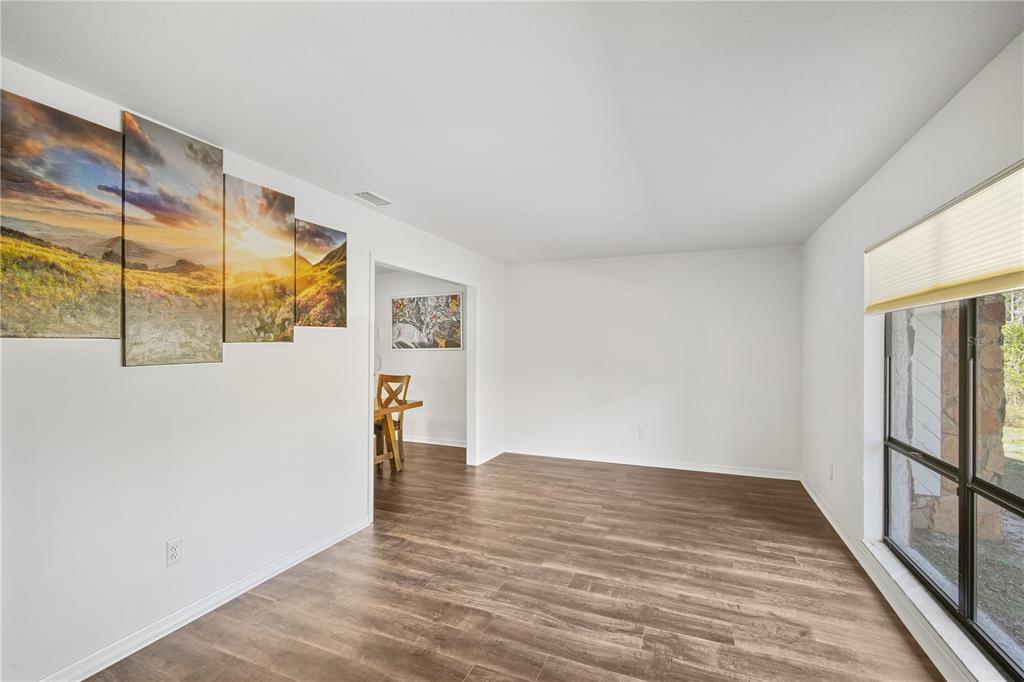 109 Holly Tree Lane Brandon, FL 33511 - Photo 12 of 31 a view of empty room with wooden floor