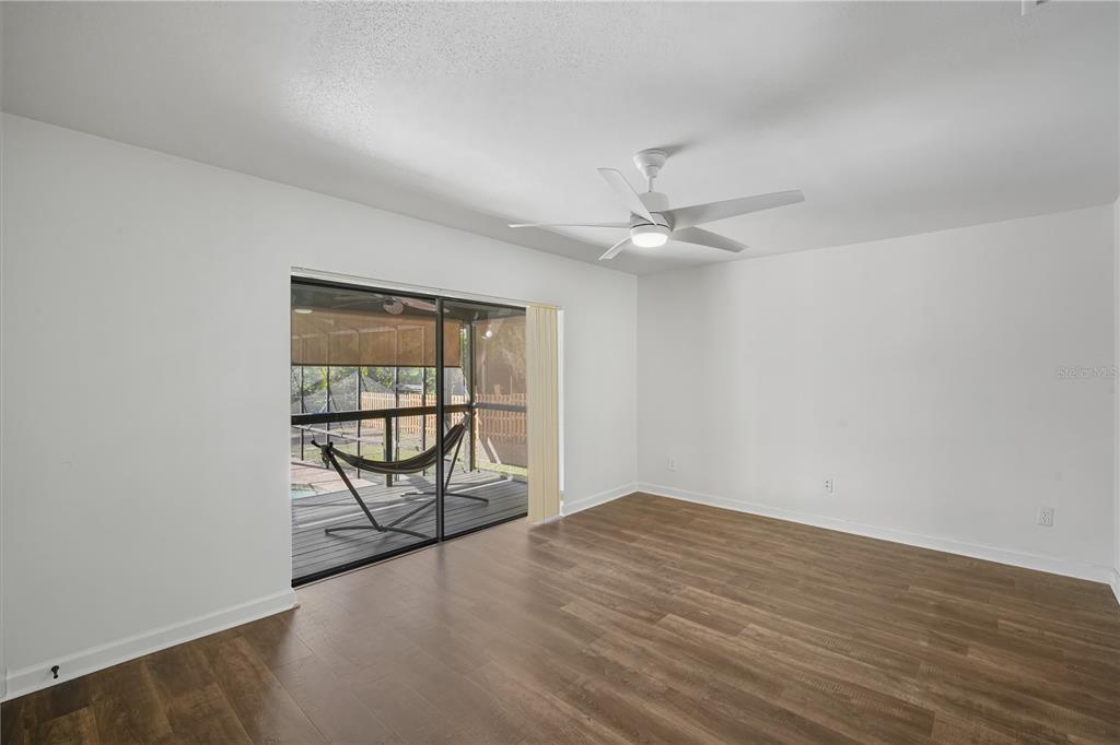 109 Holly Tree Lane Brandon, FL 33511 - Photo 14 of 31 wooden floor in an empty room with a window