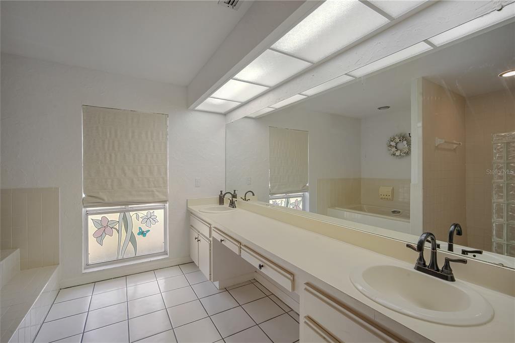 109 Holly Tree Lane Brandon, FL 33511 - Photo 16 of 31 a bathroom with a sink a toilet and a mirror
