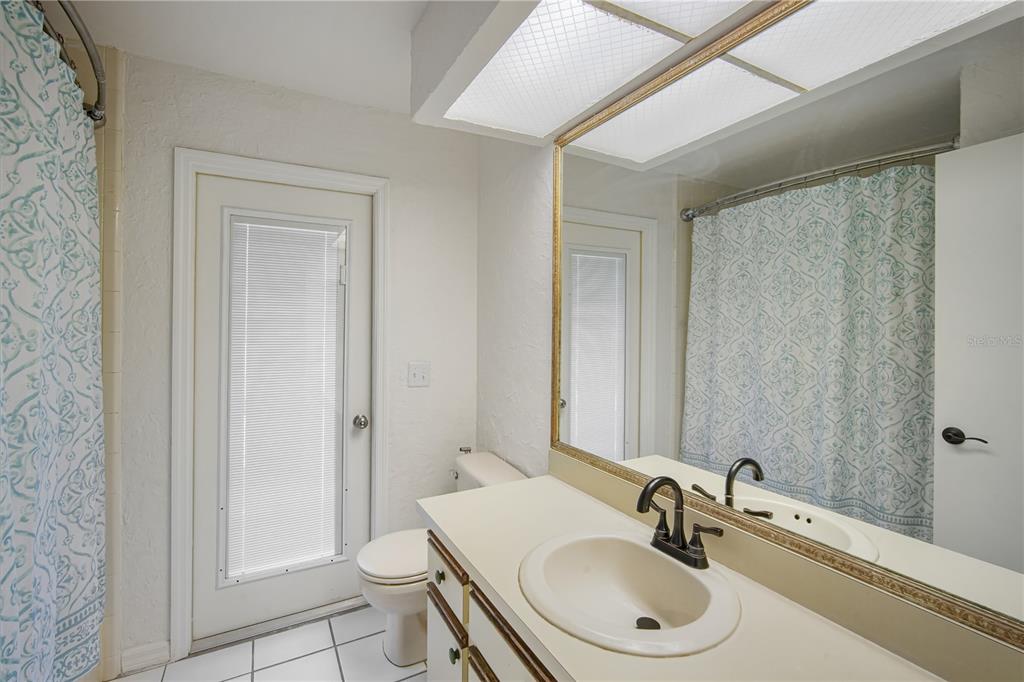 109 Holly Tree Lane Brandon, FL 33511 - Photo 19 of 31 a bathroom with a sink a toilet and shower