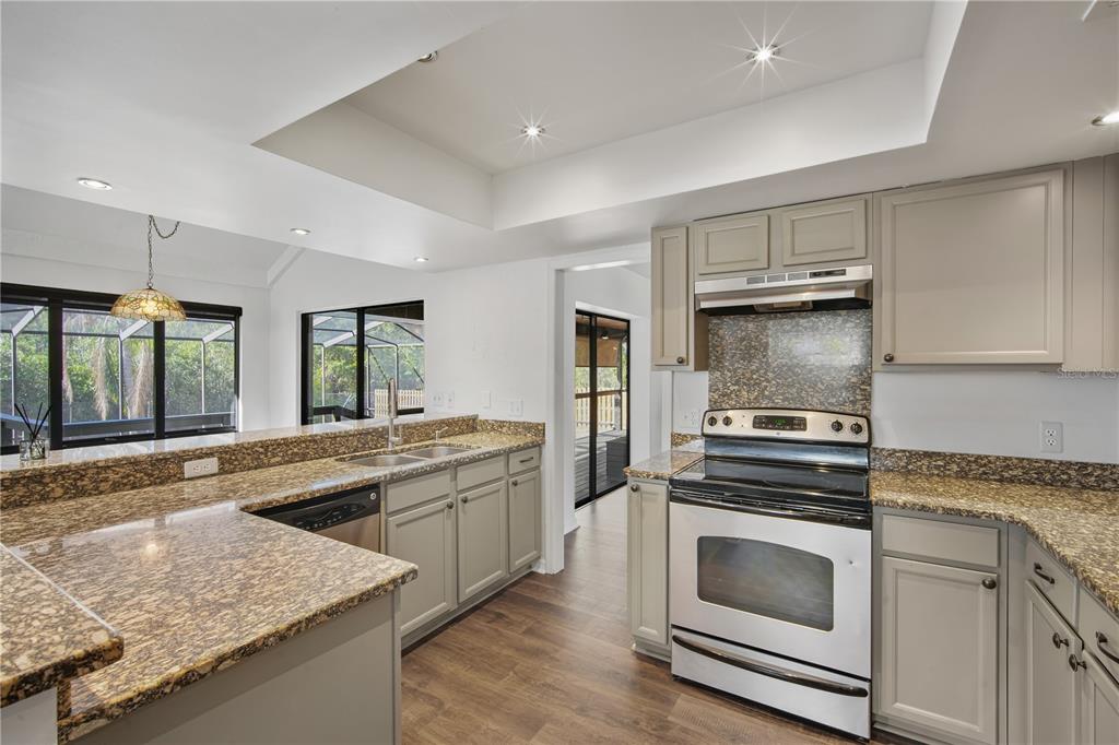 109 Holly Tree Lane Brandon, FL 33511 - Photo 10 of 31 a kitchen with a stove and a sink