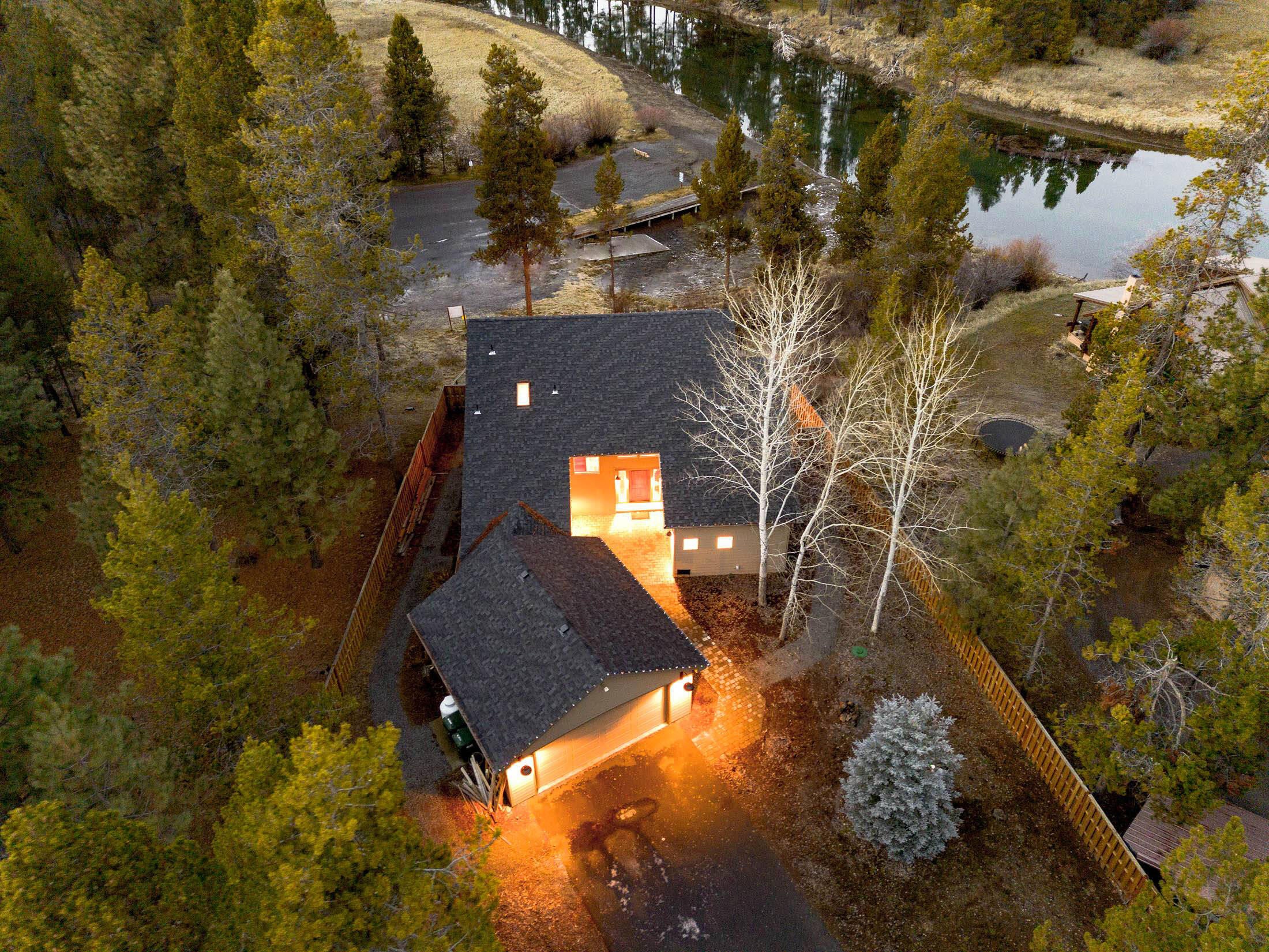 56065 Snow Goose Road Bend, OR 97707 - Photo 2 of 65 Private ommunity dock. Home has upper & lower views of the river...only bathrooms, laundry rooms don't have a river view! Room for your boat on property. Closest home to the marina. Fully fenced, gated! Private community boat dock is steps away. Home has ample space to bring your boat and park it on the half acre property.