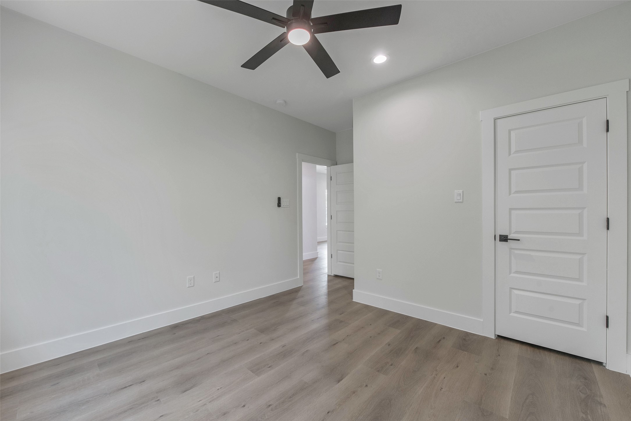 9311 Jutland Road Houston, TX 77033 - Photo 22 of 28 The third bedroom features a closet and a bright, comfortable layout with a clean, modern finish.