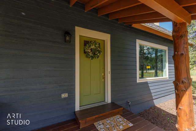 2807 North Ogden Canyon Road Eden, UT 84310 - Photo 44 of 72 Charcoal-toned horizontal siding with a contrasting lime green entry door