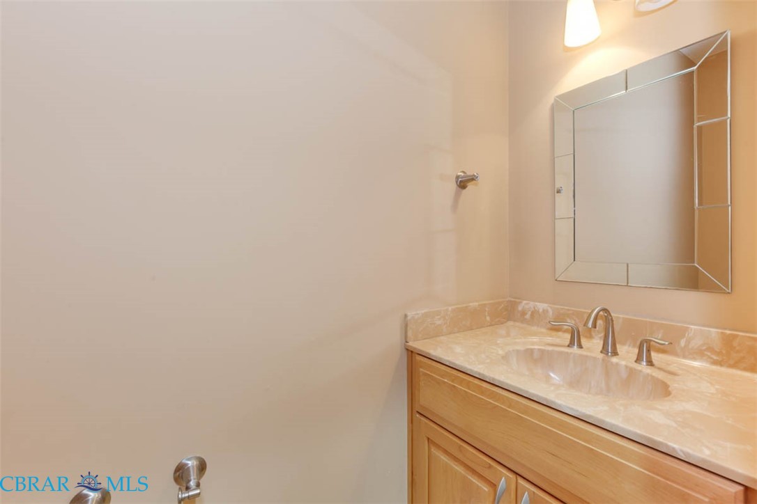 144 Meredith Street Hampton, VA 23669 - Photo 21 of 36 a bathroom with a granite countertop sink and a mirror