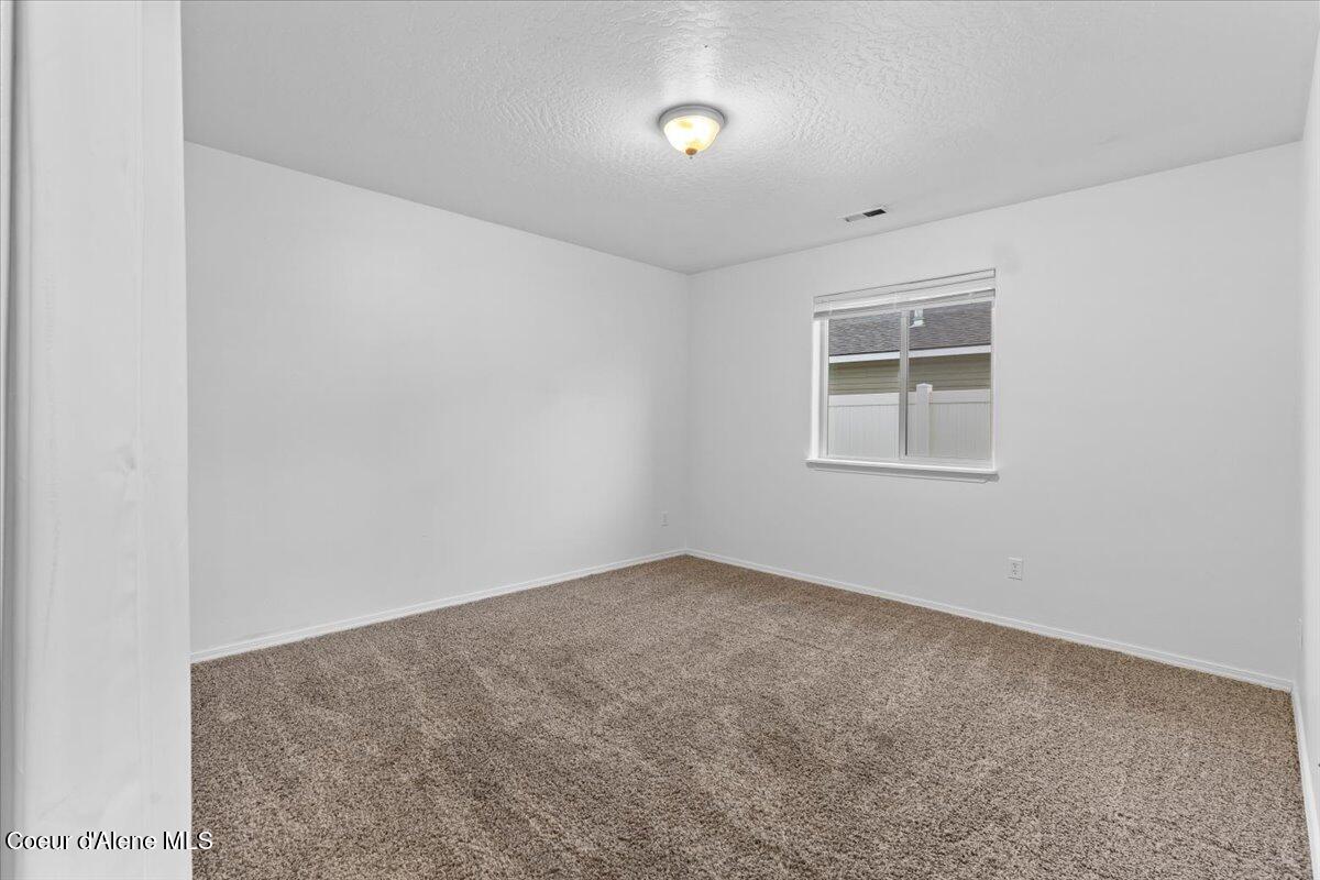 3483 West Lotze Loop Coeur D'Alene, ID 83815 - Photo 11 of 56 Main floor guest bedroom