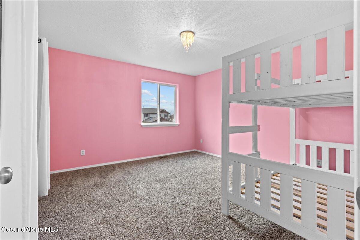 3483 West Lotze Loop Coeur D'Alene, ID 83815 - Photo 29 of 56 Pretty In Pink!!! Upstairs Bedroom