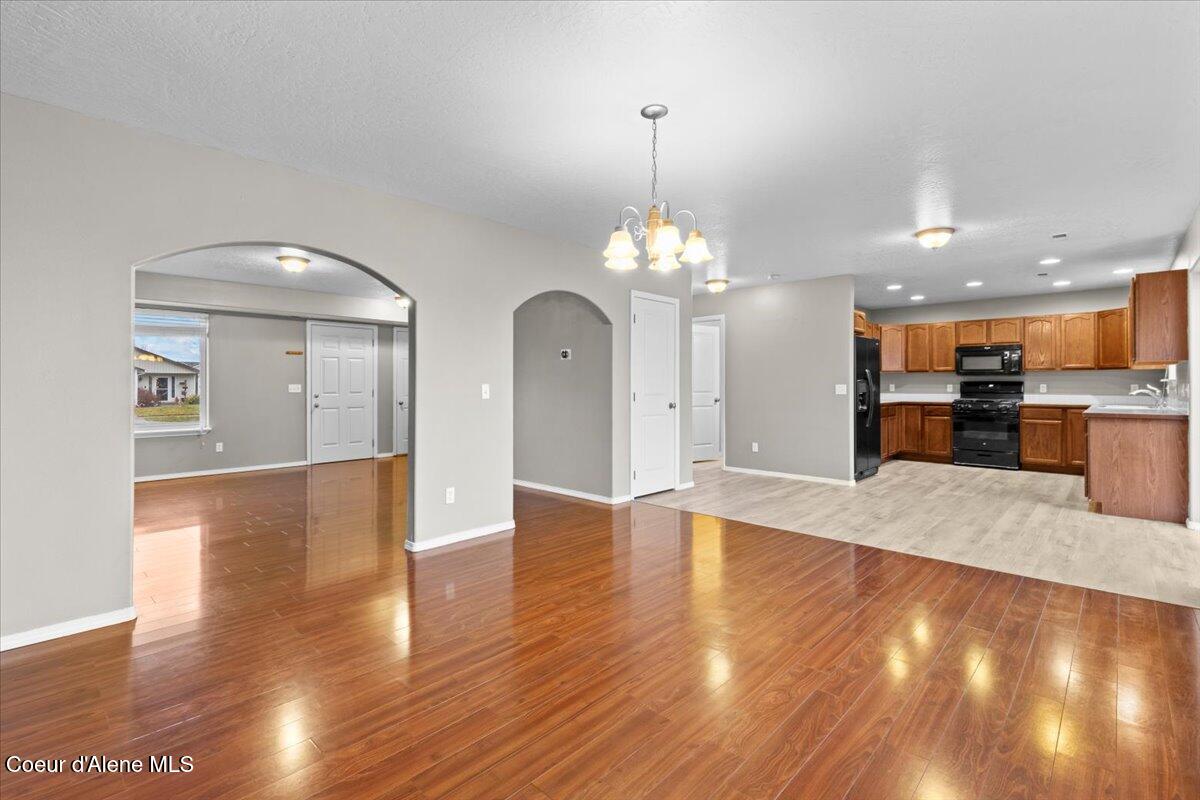 3483 West Lotze Loop Coeur D'Alene, ID 83815 - Photo 5 of 56 Den looking into dining and kitchen