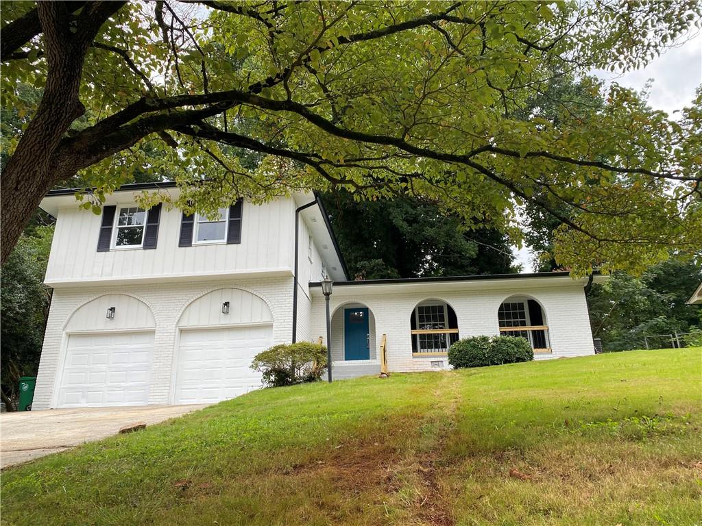 2248 Chevy Chase Lane Decatur, GA 30032 - Photo 1 of 1 a front view of a house with garden