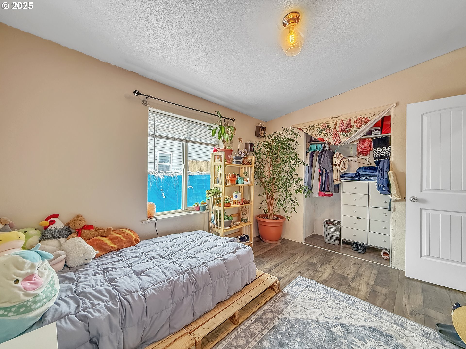 2084 18th Street Baker City, OR 97814 - Photo 21 of 40 a bedroom with bed and window