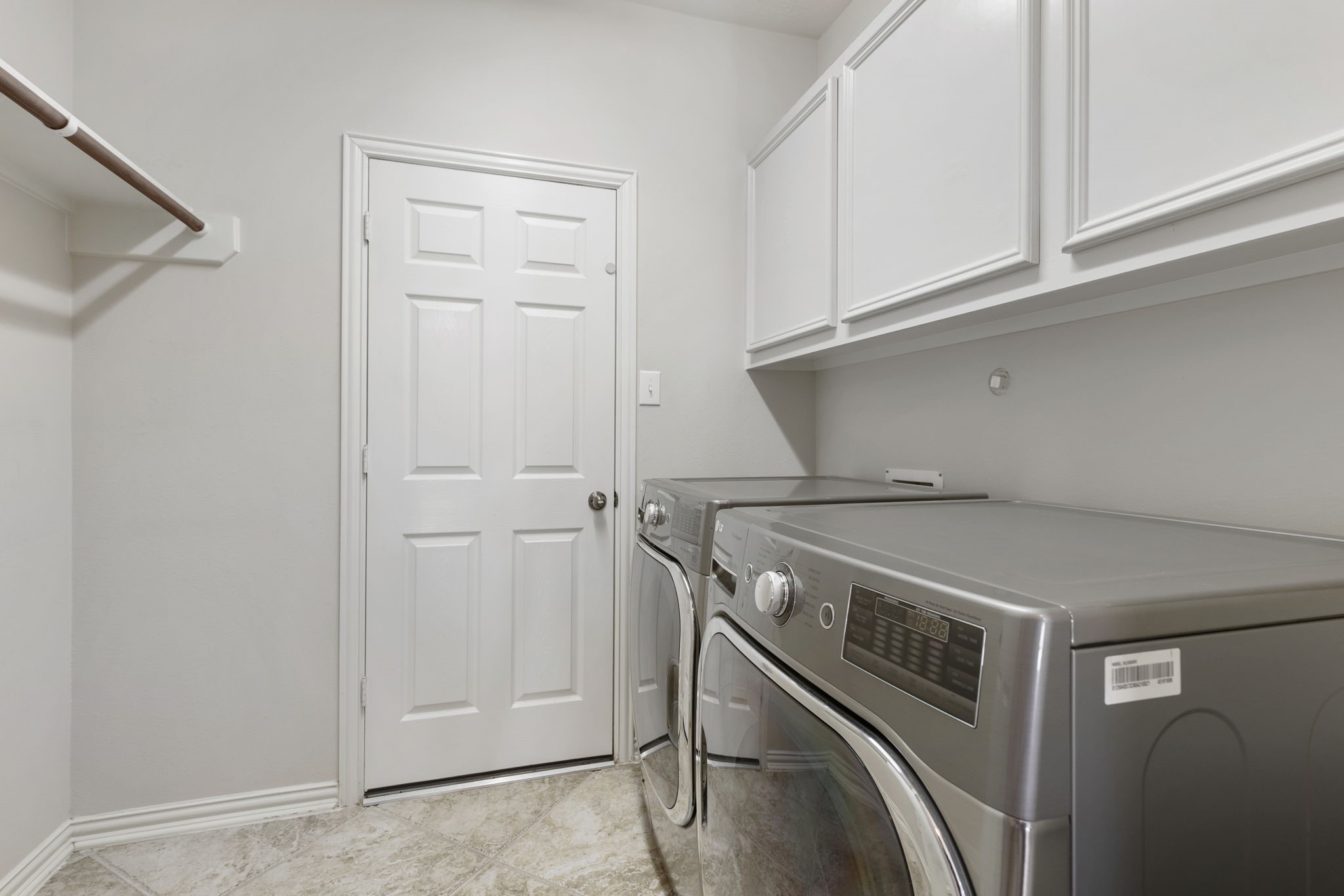 80 North Frontera Circle Spring, TX 77382 - Photo 13 of 28 Laundry room includes washer and dryer set and built-in cabinets.