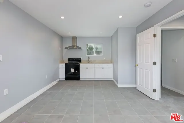 a big room with closet and cabinet
