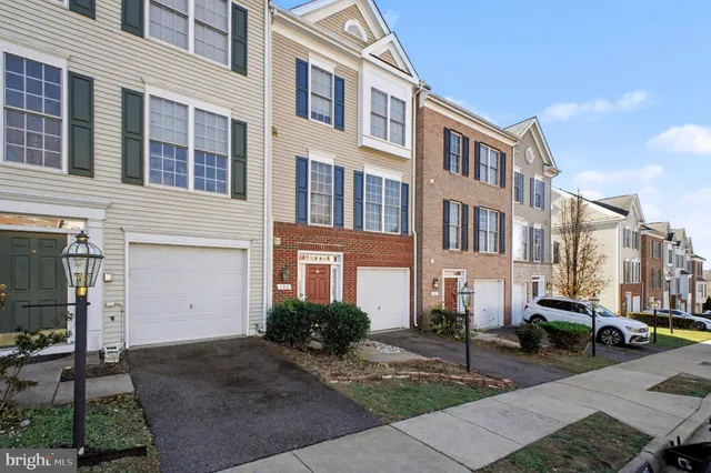 a city street lined with buildings and cars