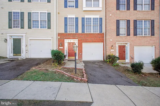 a view of a brick building next to a yard