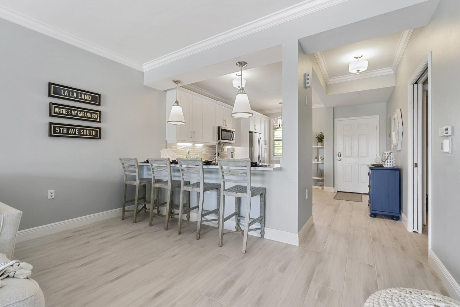 3780 Sawgrass Way, Unit 3325 Naples, FL 34112 - Photo 12 of 49 a view of a dining room with furniture and wooden floor