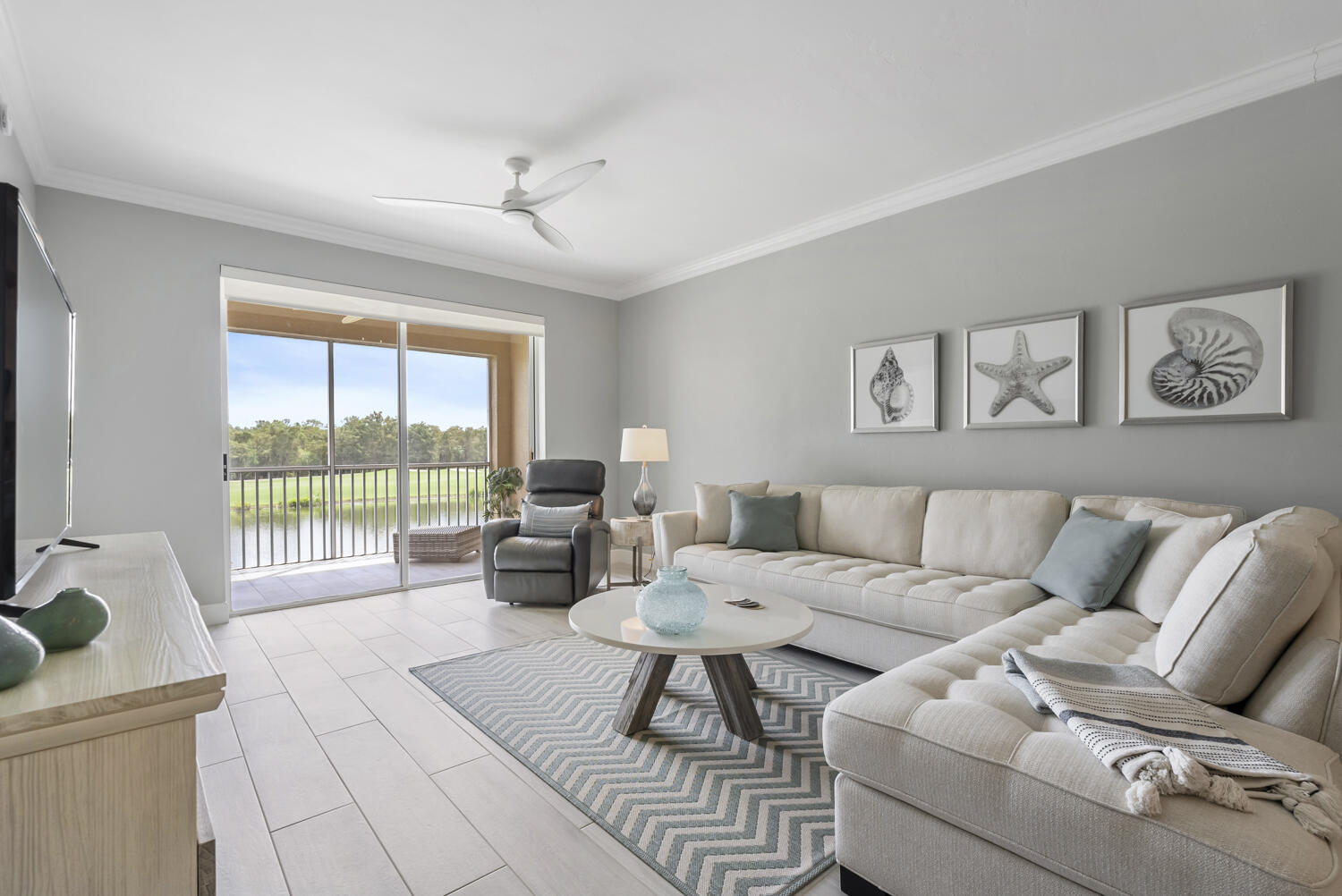 3780 Sawgrass Way, Unit 3325 Naples, FL 34112 - Photo 14 of 49 a living room with furniture and a large window