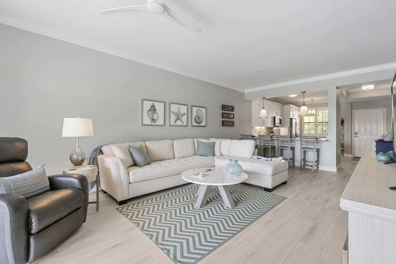 3780 Sawgrass Way, Unit 3325 Naples, FL 34112 - Photo 15 of 49 a living room with furniture and a table