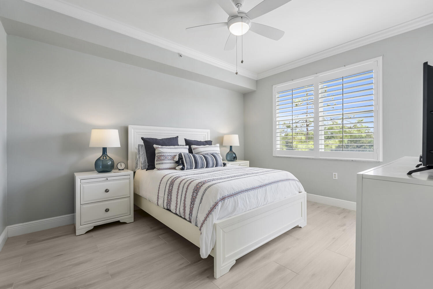 3780 Sawgrass Way, Unit 3325 Naples, FL 34112 - Photo 17 of 49 a spacious bedroom with a bed and a window