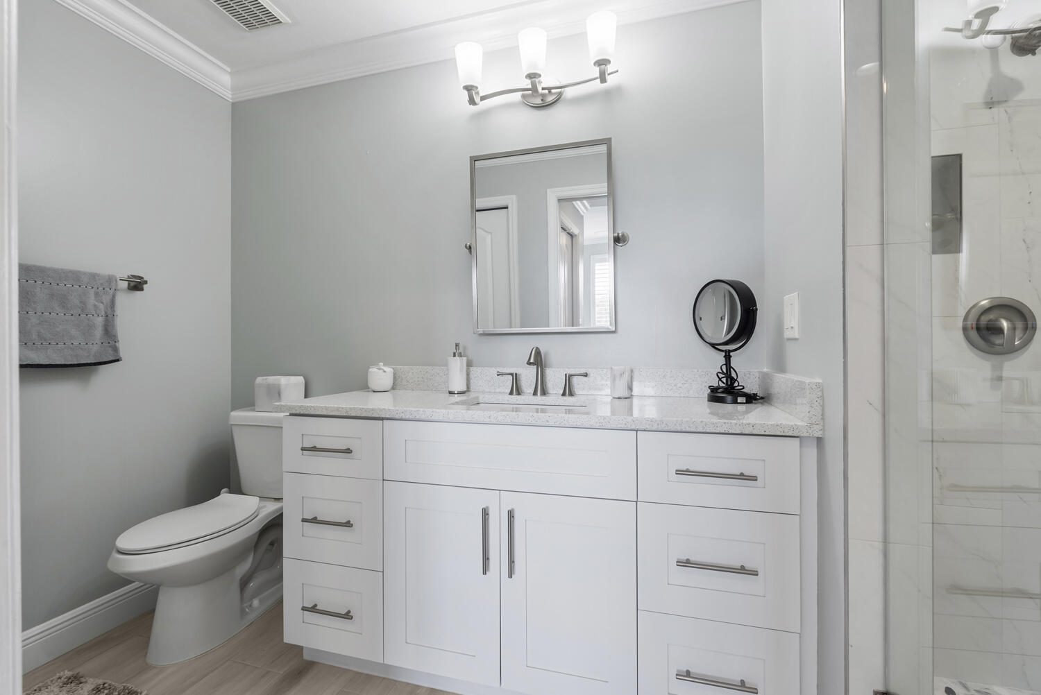 3780 Sawgrass Way, Unit 3325 Naples, FL 34112 - Photo 20 of 49 a bathroom with a toilet sink and mirror