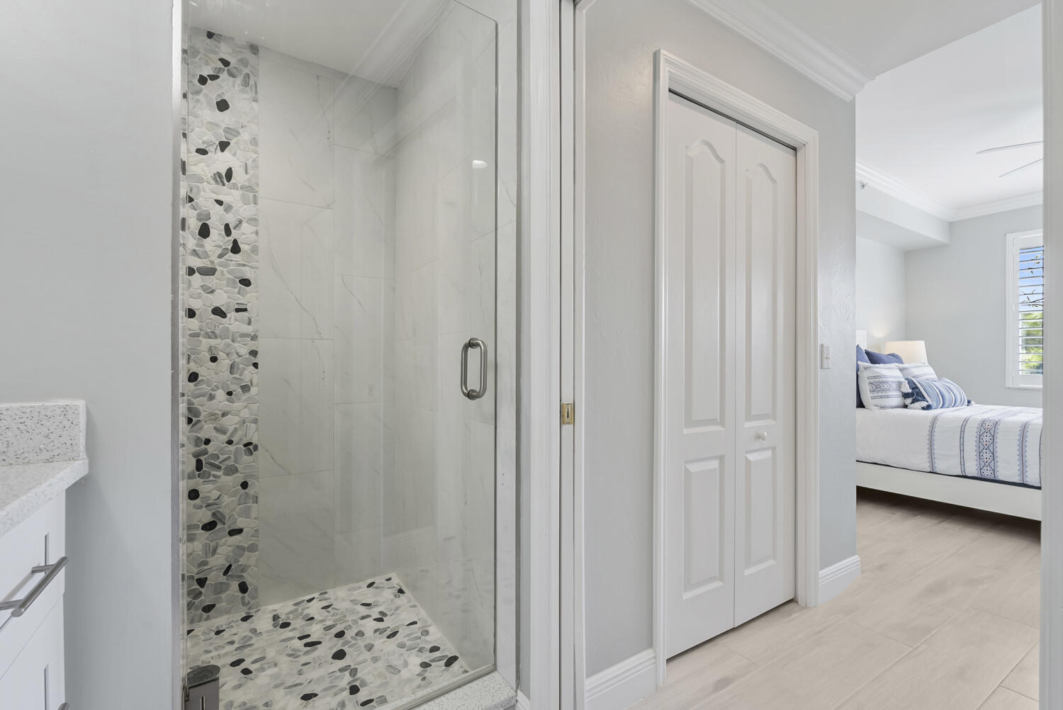 3780 Sawgrass Way, Unit 3325 Naples, FL 34112 - Photo 21 of 49 a bedroom with a bed and a walk in closet