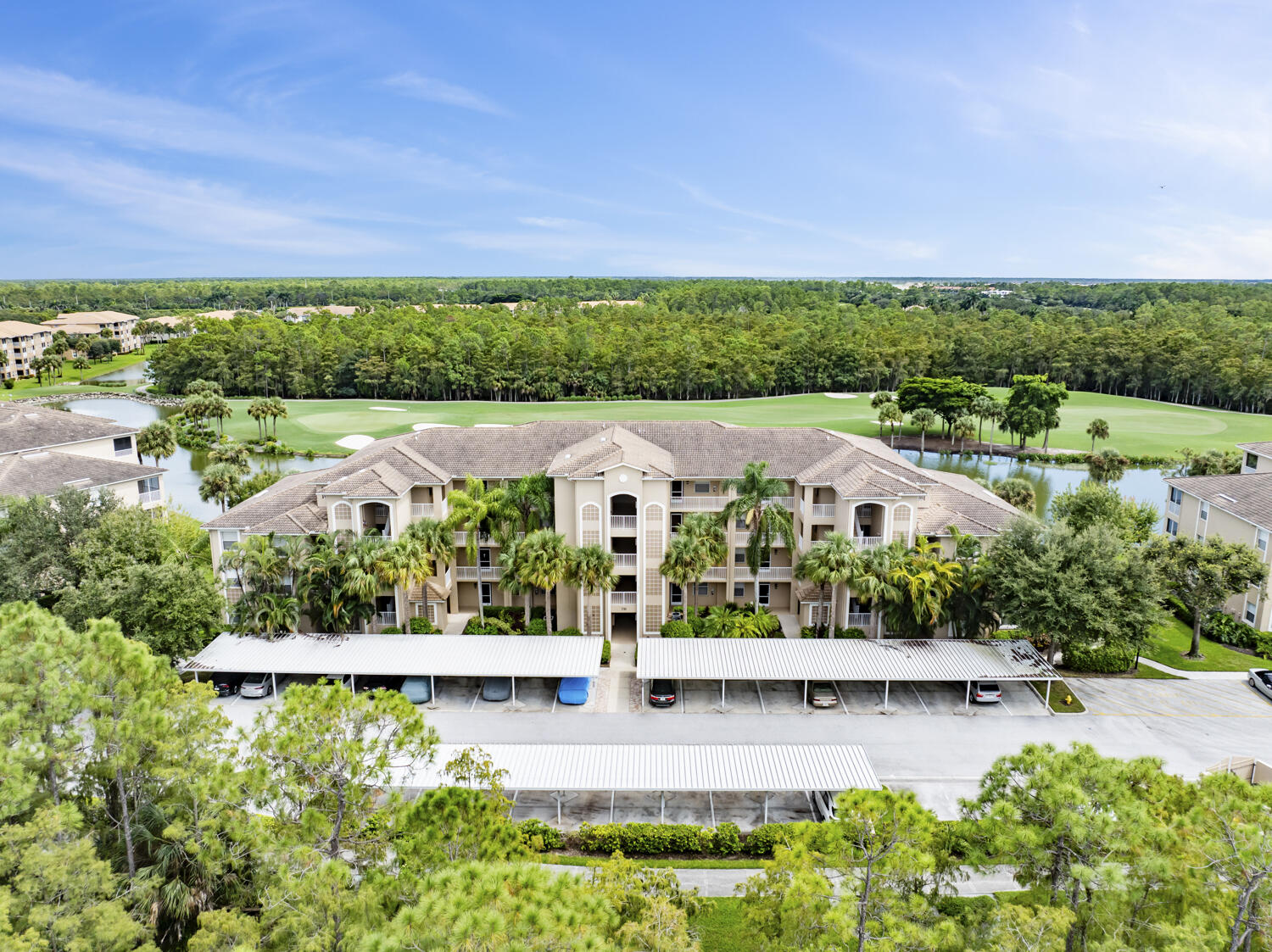 3780 Sawgrass Way, Unit 3325 Naples, FL 34112 - Photo 28 of 49 an aerial view of house with a yard