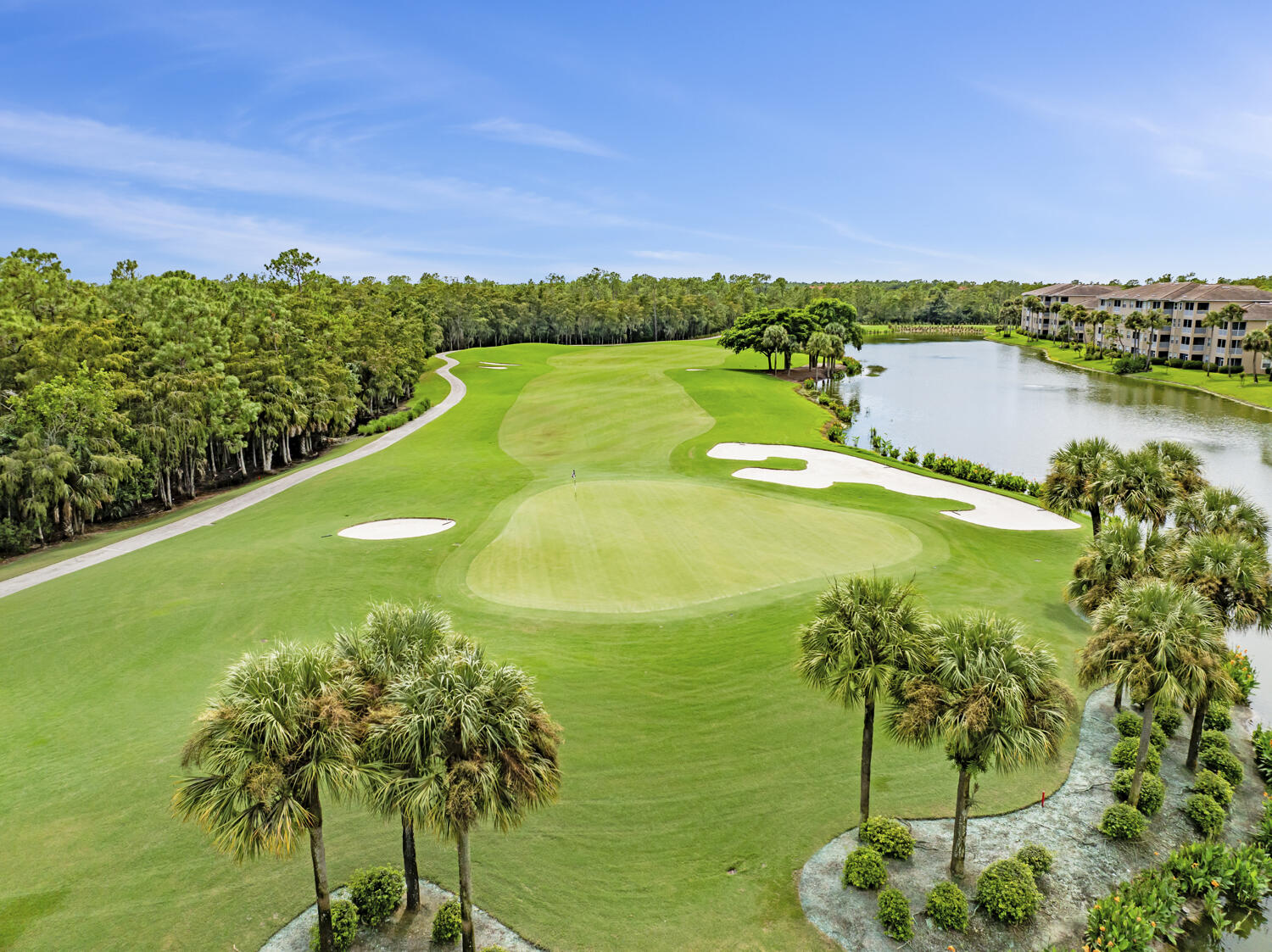 3780 Sawgrass Way, Unit 3325 Naples, FL 34112 - Photo 29 of 49 a view of a lake with a mountain in the background