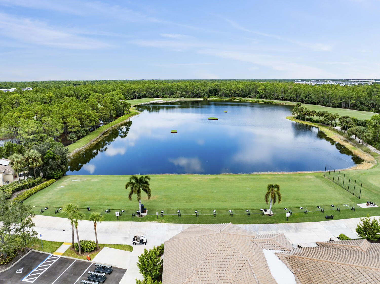 3780 Sawgrass Way, Unit 3325 Naples, FL 34112 - Photo 32 of 49 an aerial view of a house with a garden and lake view