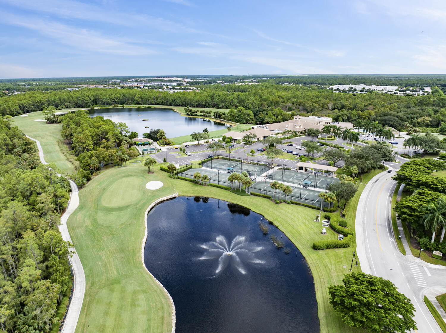 3780 Sawgrass Way, Unit 3325 Naples, FL 34112 - Photo 34 of 49 a view of a lake with a mountain in the background