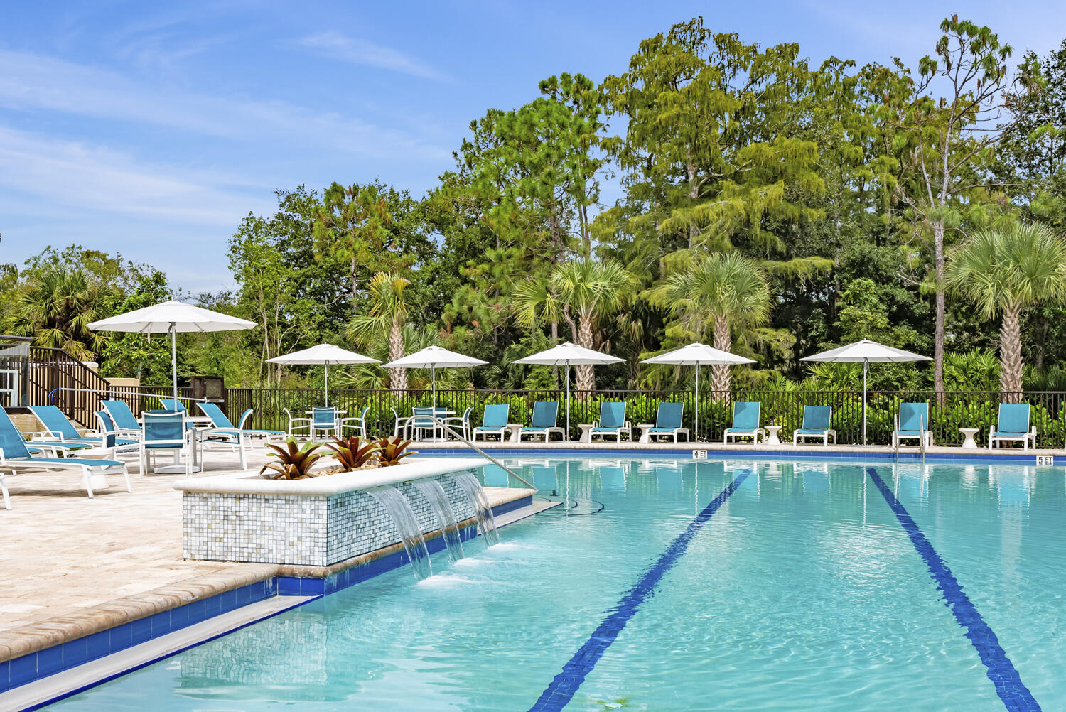 3780 Sawgrass Way, Unit 3325 Naples, FL 34112 - Photo 36 of 49 a view of a swimming pool with lounge chairs in patio
