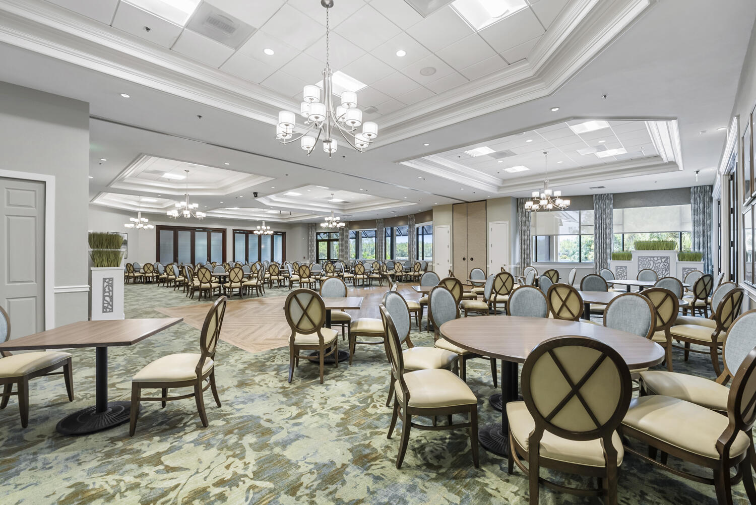 3780 Sawgrass Way, Unit 3325 Naples, FL 34112 - Photo 37 of 49 a view of a dining room with furniture a chandelier and wooden floor