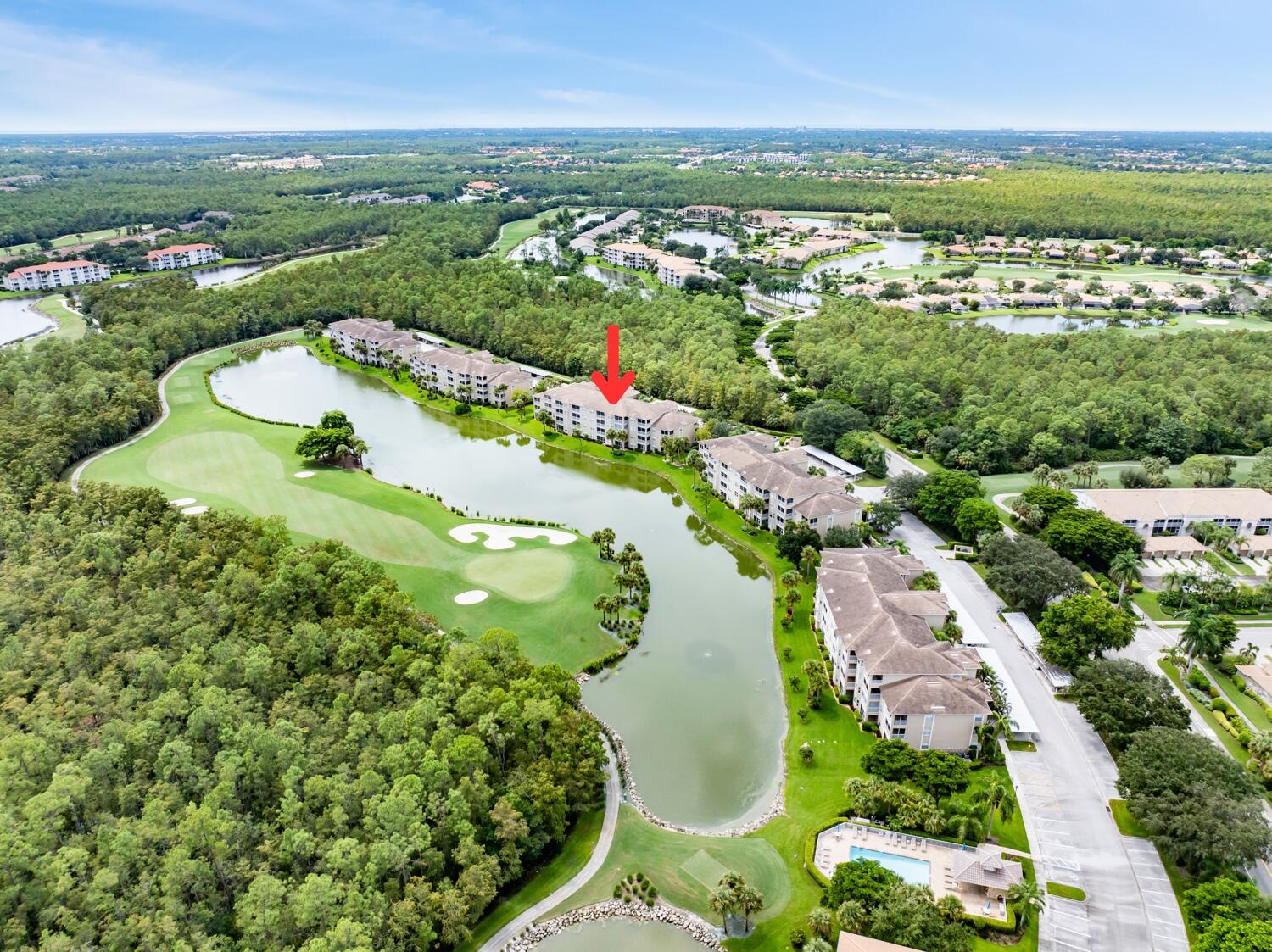 3780 Sawgrass Way, Unit 3325 Naples, FL 34112 - Photo 41 of 49 an aerial view of lake residential houses with outdoor space and garden