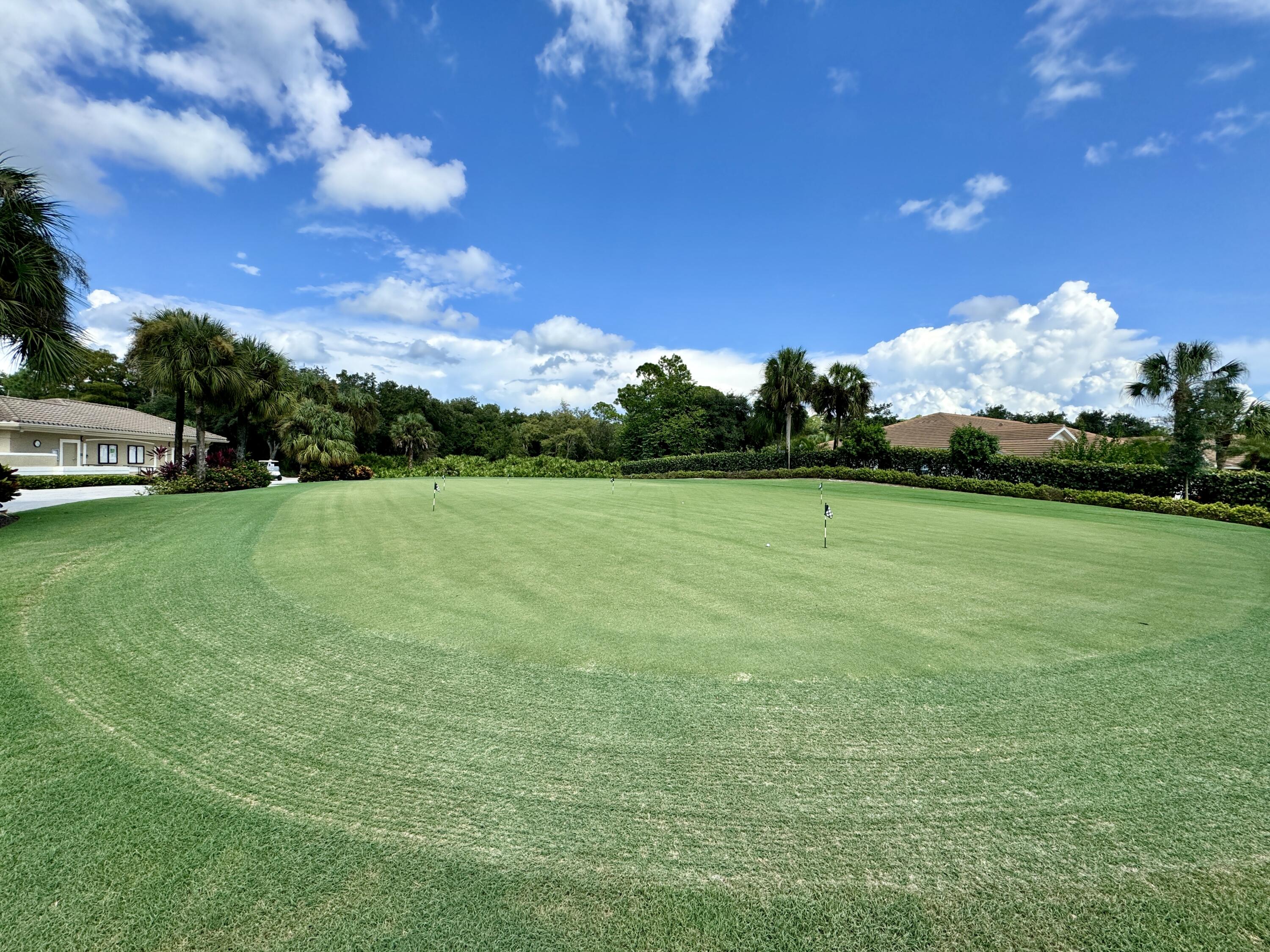 3780 Sawgrass Way, Unit 3325 Naples, FL 34112 - Photo 44 of 49 a view of a golf course with a lake