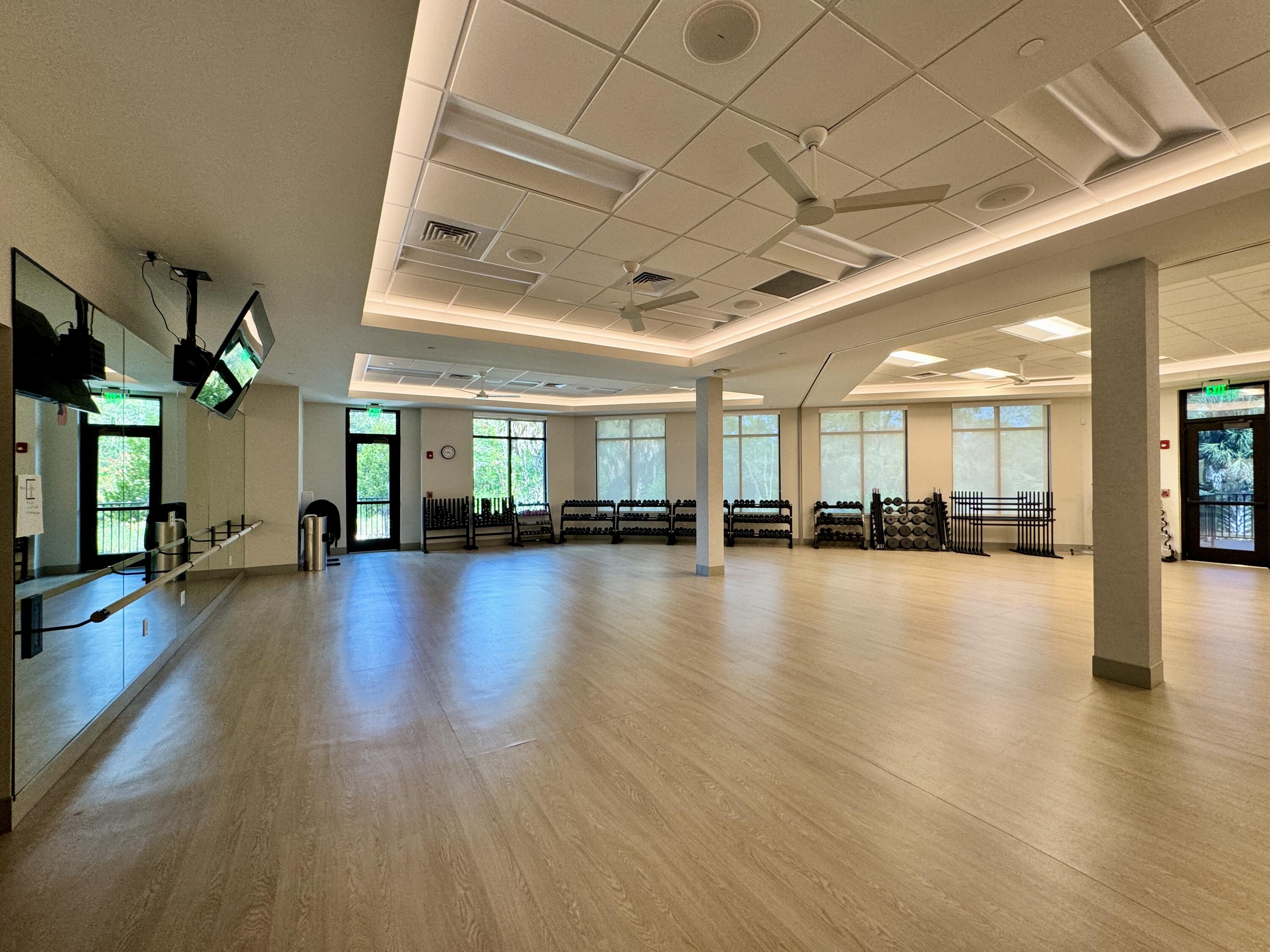 3780 Sawgrass Way, Unit 3325 Naples, FL 34112 - Photo 48 of 49 a view of a livingroom with lots of furniture and hardwood floor