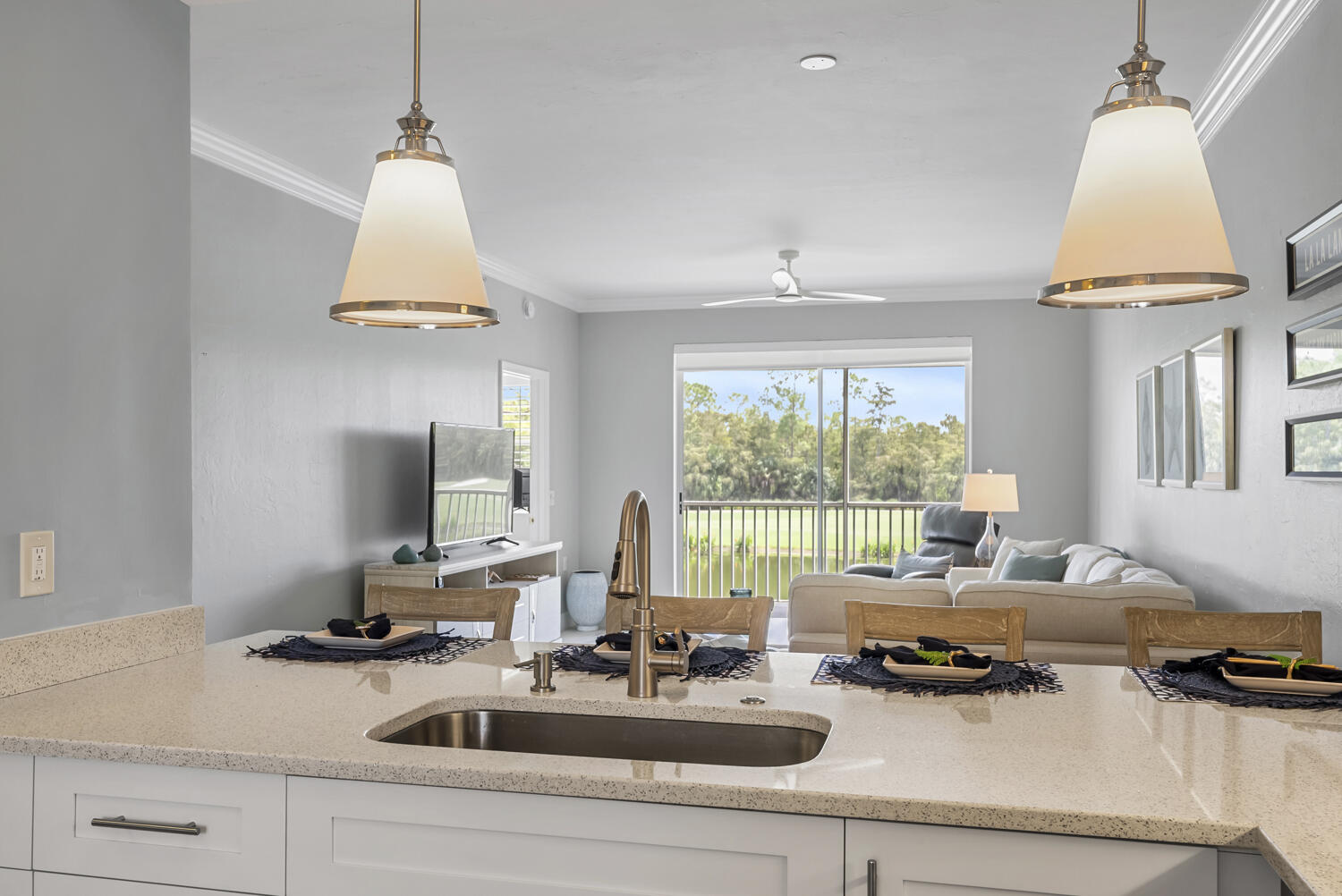 3780 Sawgrass Way, Unit 3325 Naples, FL 34112 - Photo 9 of 49 a kitchen with a sink a window and a wooden floor