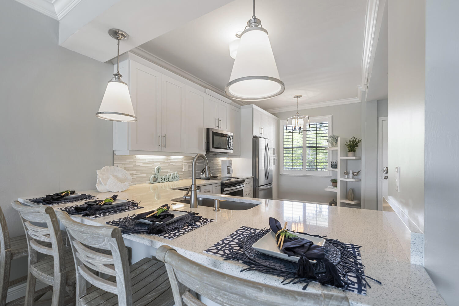 3780 Sawgrass Way, Unit 3325 Naples, FL 34112 - Photo 10 of 49 a dining room with furniture a chandelier and wooden floor