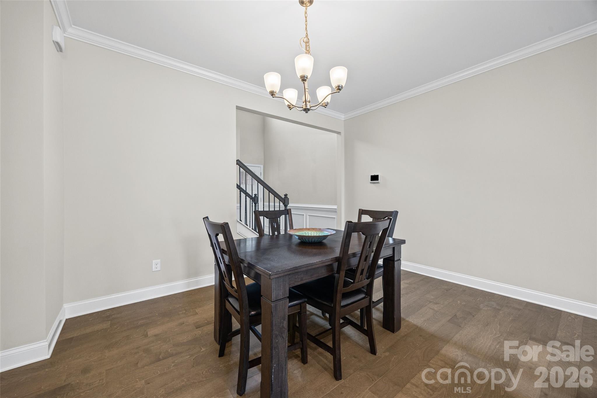 979 Pennington Drive Lancaster, SC 29720 - Photo 11 of 47 a dining room with a wooden table and chairs
