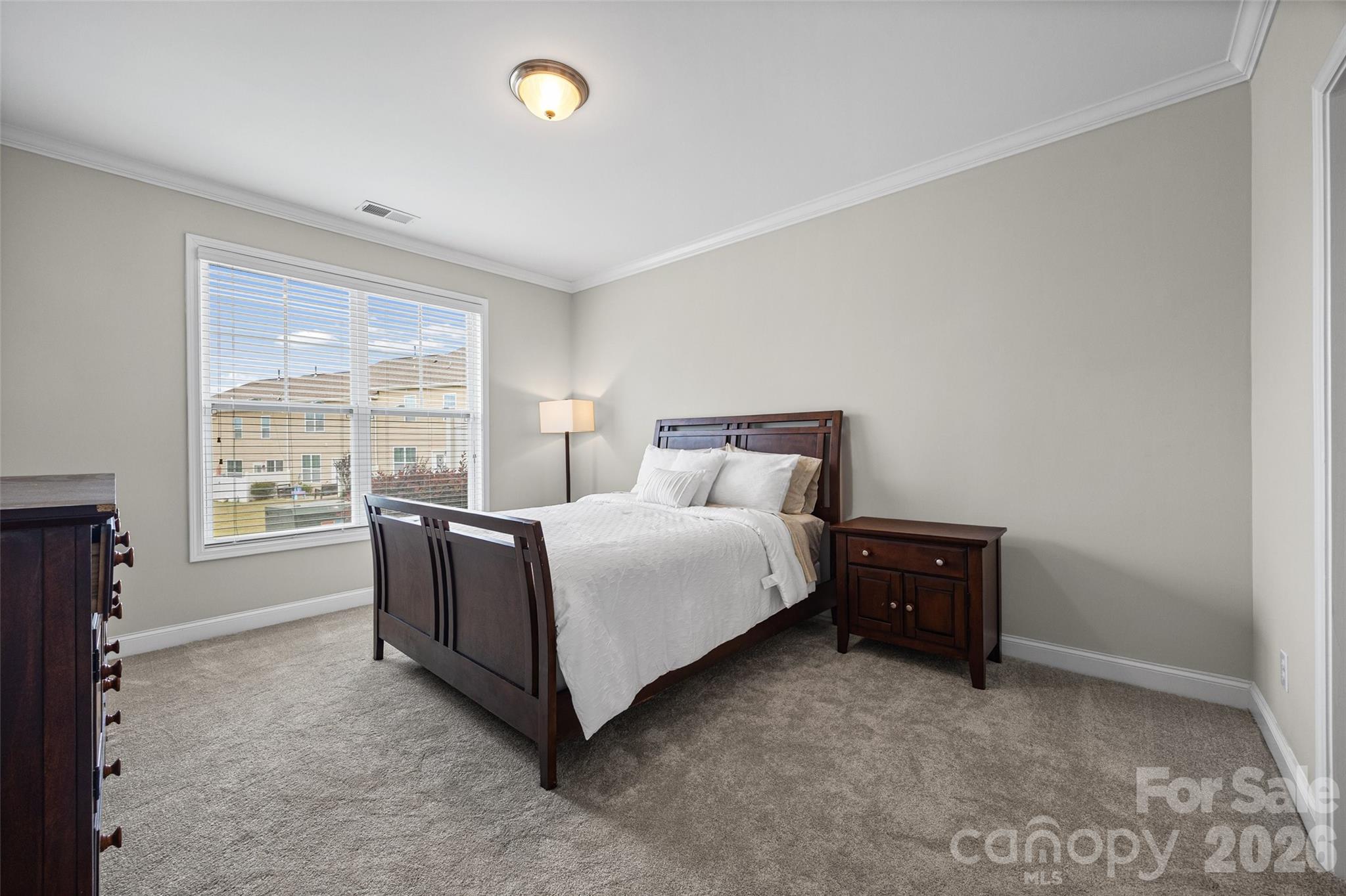 979 Pennington Drive Lancaster, SC 29720 - Photo 13 of 47 a spacious bedroom with a bed and a window