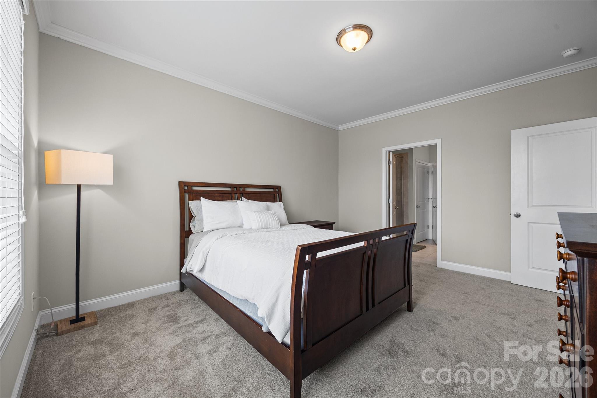 979 Pennington Drive Lancaster, SC 29720 - Photo 14 of 47 a bedroom with a bed and a lamp