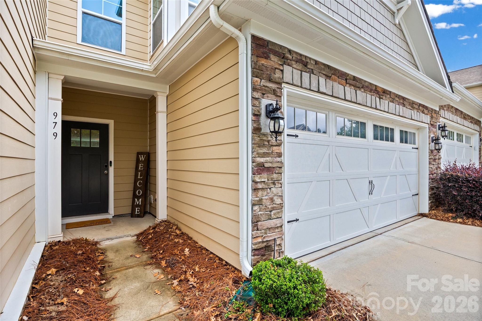 979 Pennington Drive Lancaster, SC 29720 - Photo 2 of 47 a view of a house with a door and wooden bench
