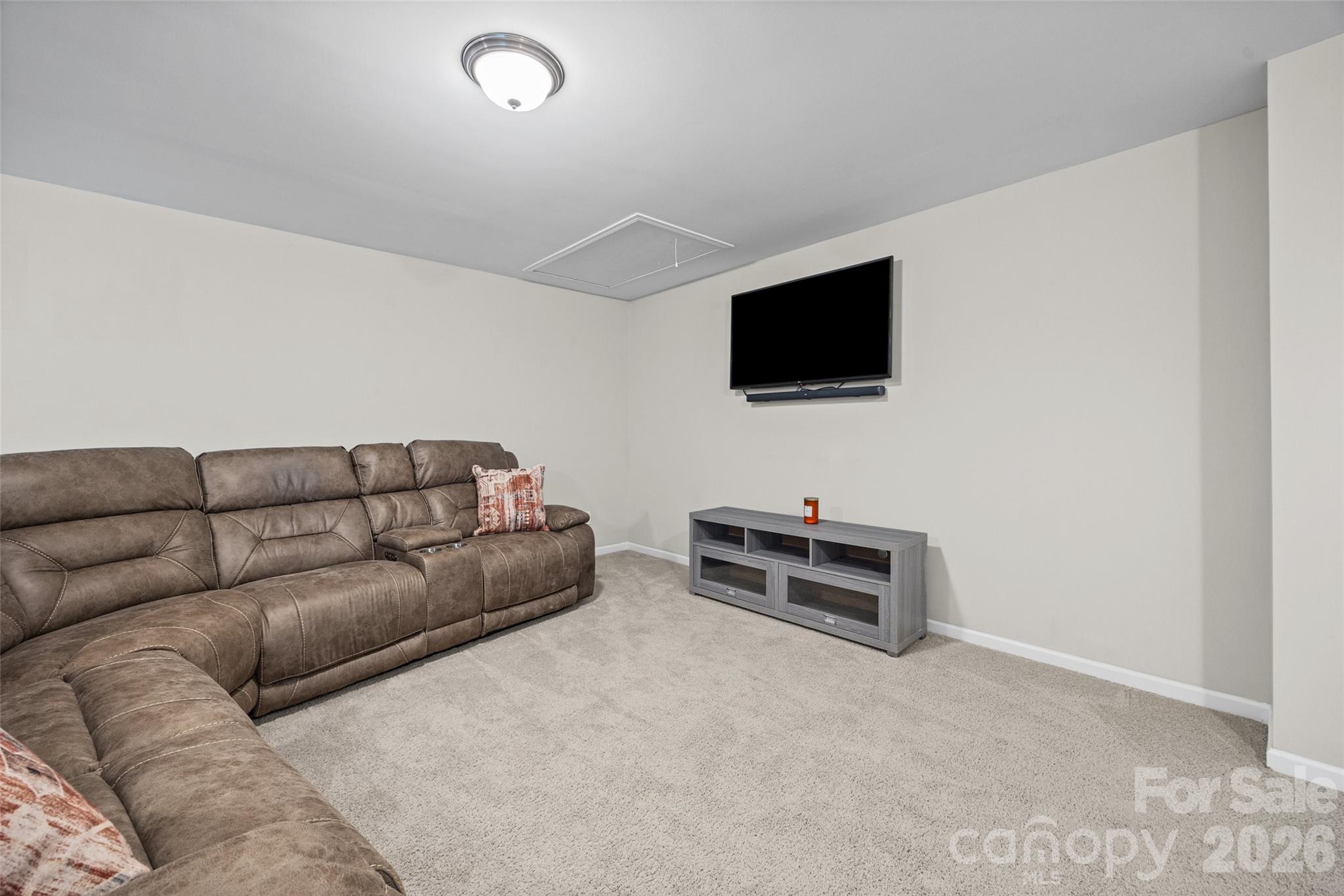 979 Pennington Drive Lancaster, SC 29720 - Photo 21 of 47 a living room with furniture and a flat screen tv