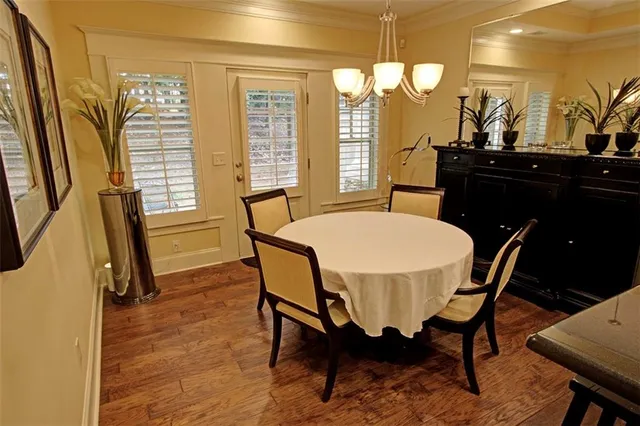 a view of a dining room with furniture and wooden floor