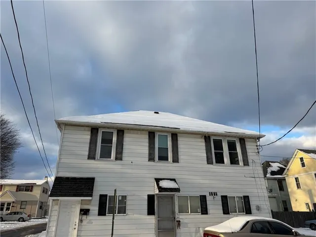 a front view of a house with parking