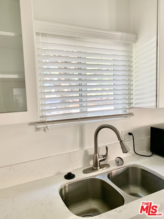 3040 Exposition Boulevard, Unit 1 Santa Monica, CA 90404 - Photo 8 of 15 a kitchen with a sink and a window