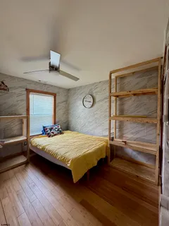 a bedroom with a bed and window