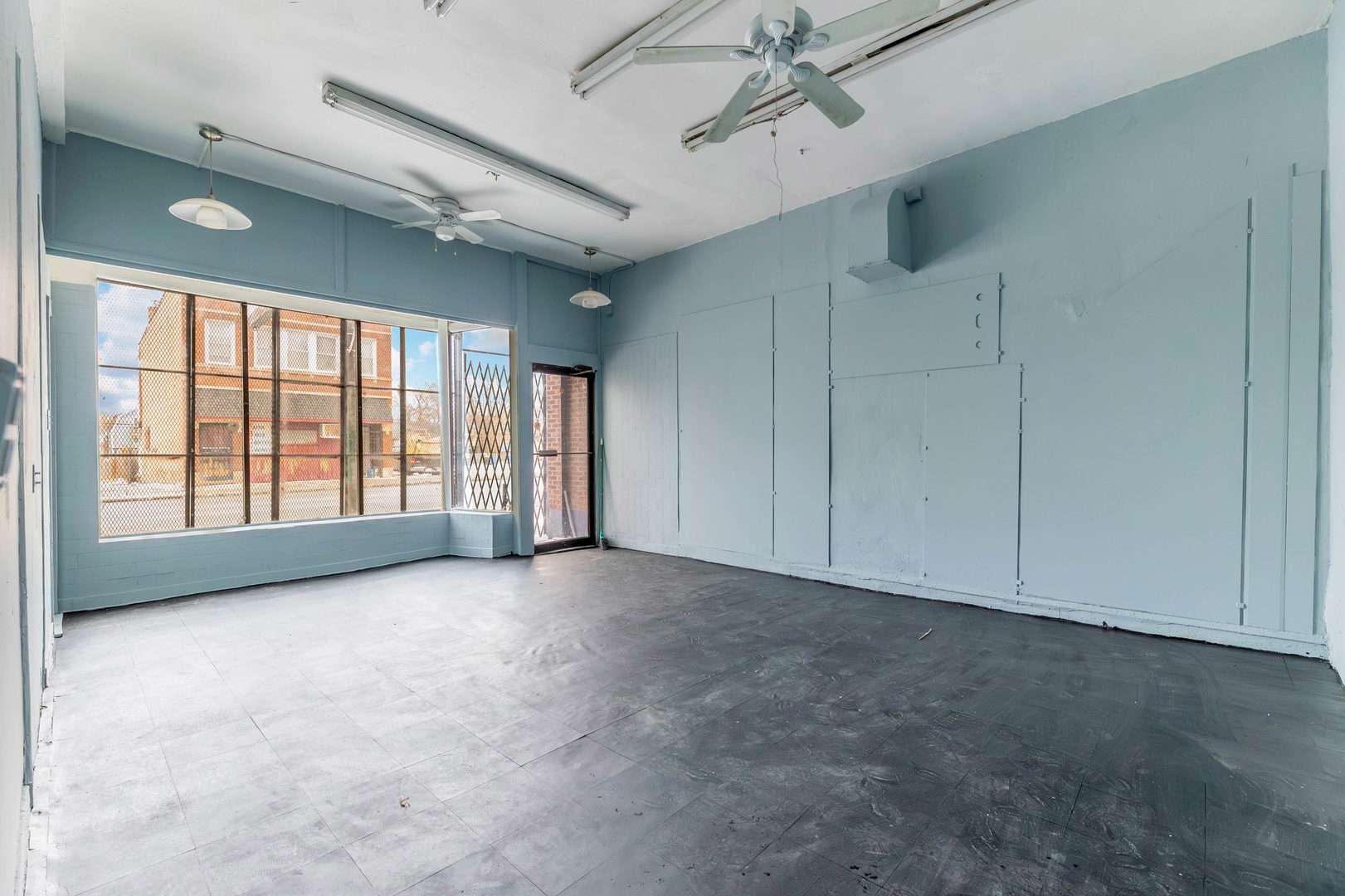 7316 South Racine Avenue Chicago, IL 60636 - Photo 3 of 15 a view of an empty room with a window
